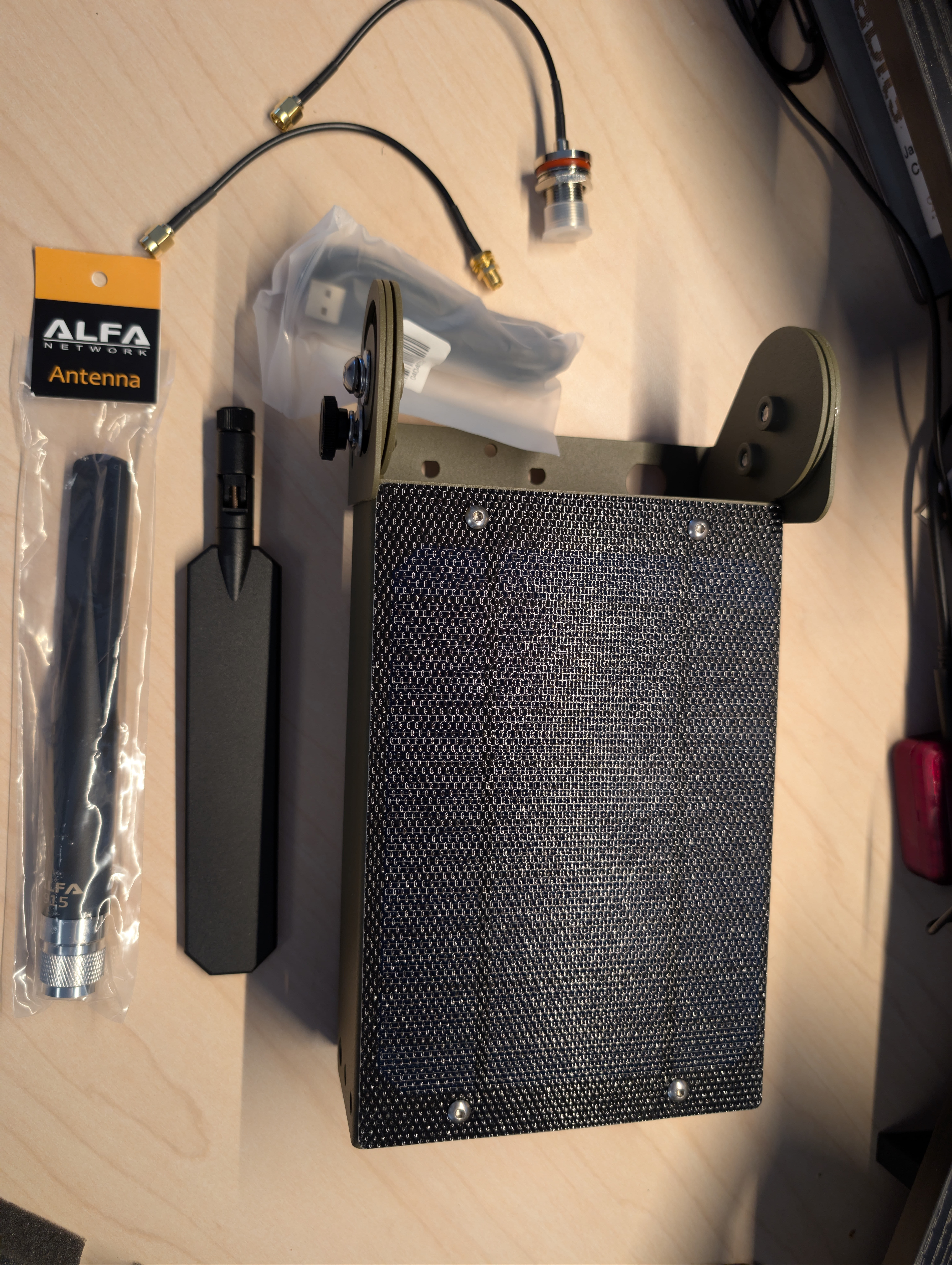 Atlavox Beacon mounted on its bracket showing the dual-pivot articulation between solar panel back and antenna mount