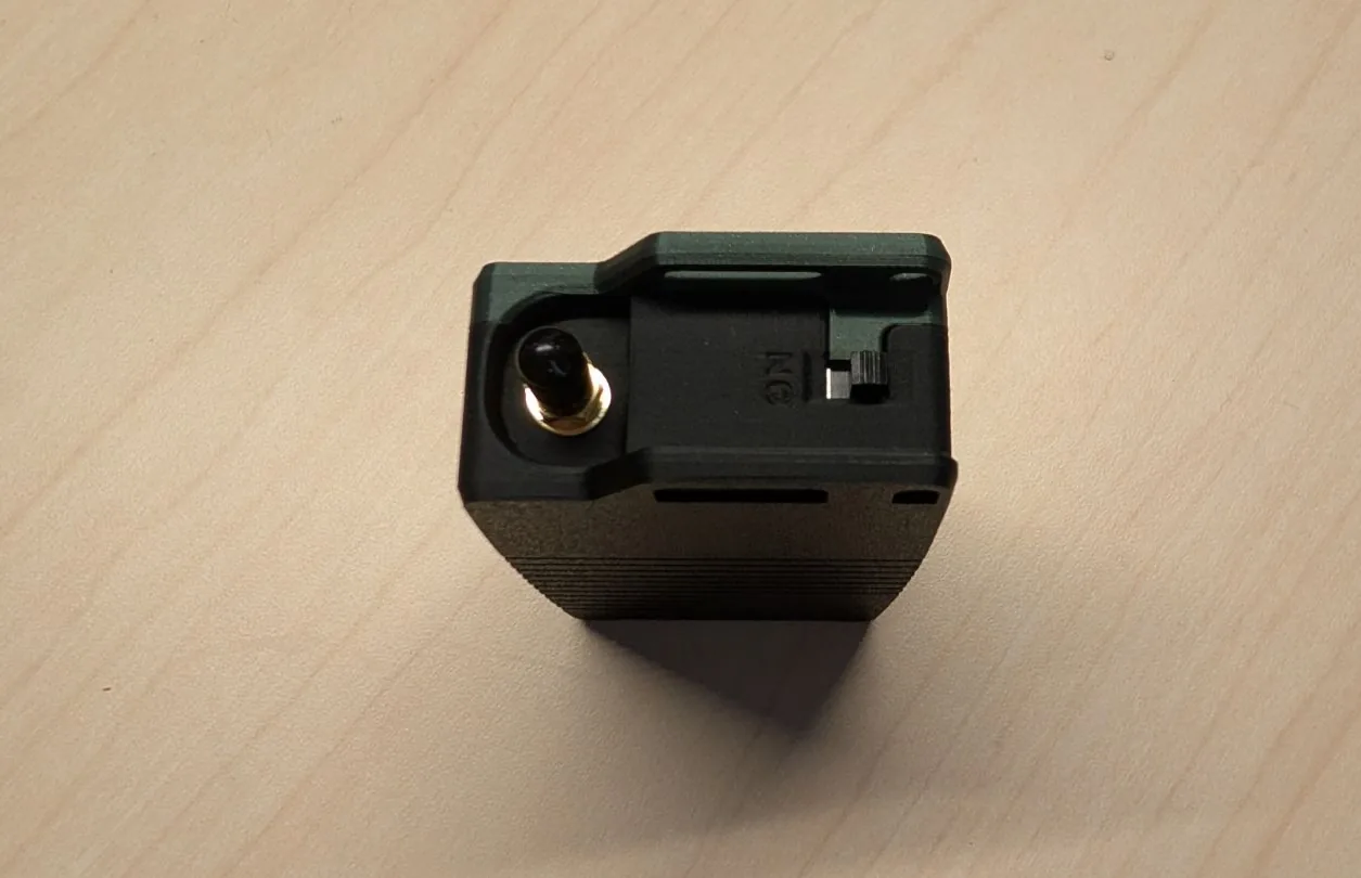 Top of the Atlavox M1 showing the SMA antenna connector and the ON switch recessed between two rails