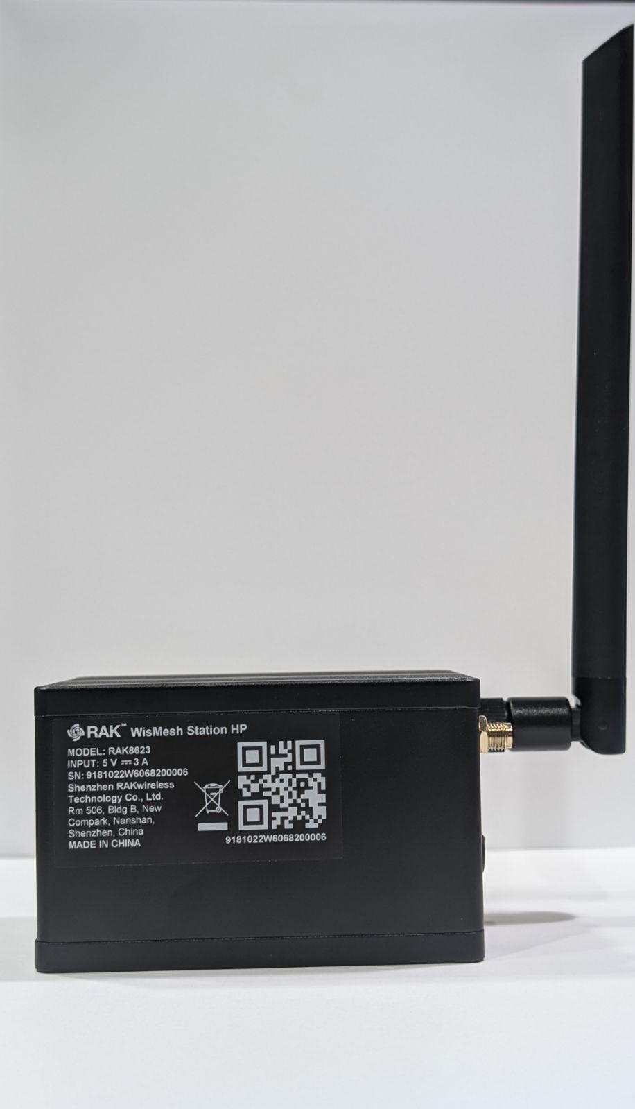 Product label on the side of the unit reading RAK WisMesh Station HP, model RAK8623, input 5 V 3 A