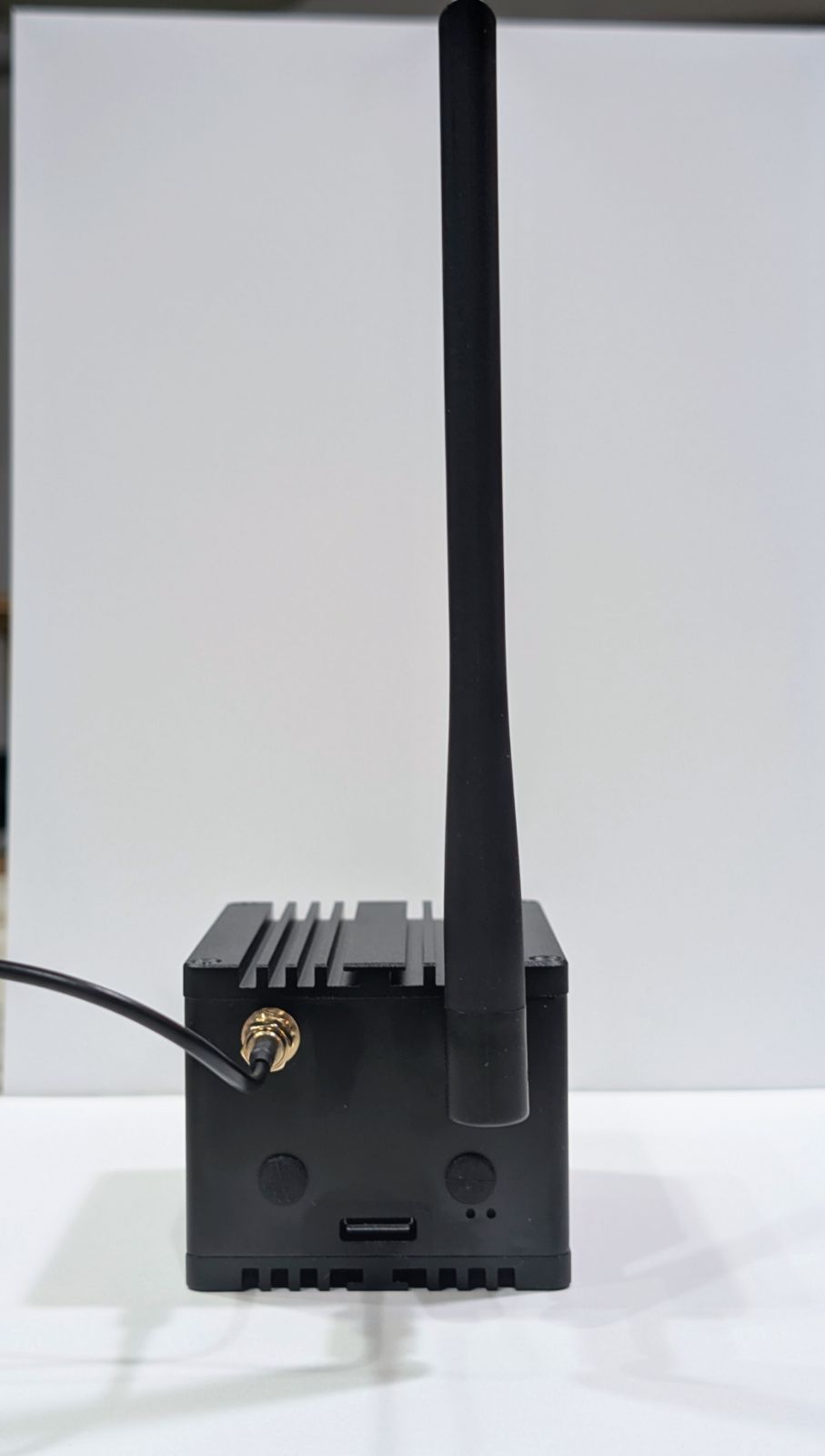 The opposite face of the WisMesh Station HP showing the GPS antenna SMA connector, LoRa antenna, USB-C power input, and status LEDs