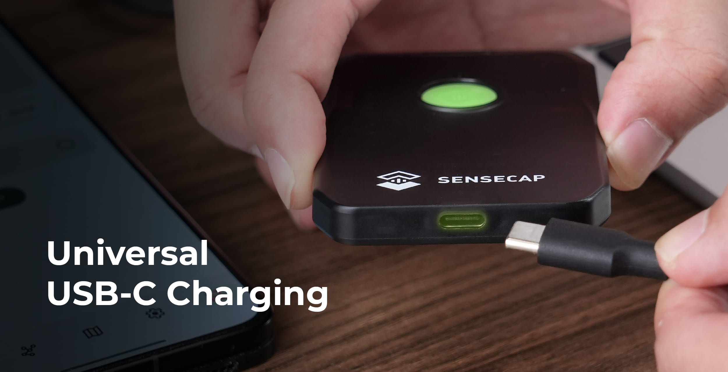 Hand plugging a USB-C cable into the SenseCAP MeshTracker X1
