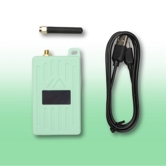 WisMesh Pocket V3 in Mint beside its stubby SMA antenna and a black USB cable, everything that comes in the box. Image: Rokland.